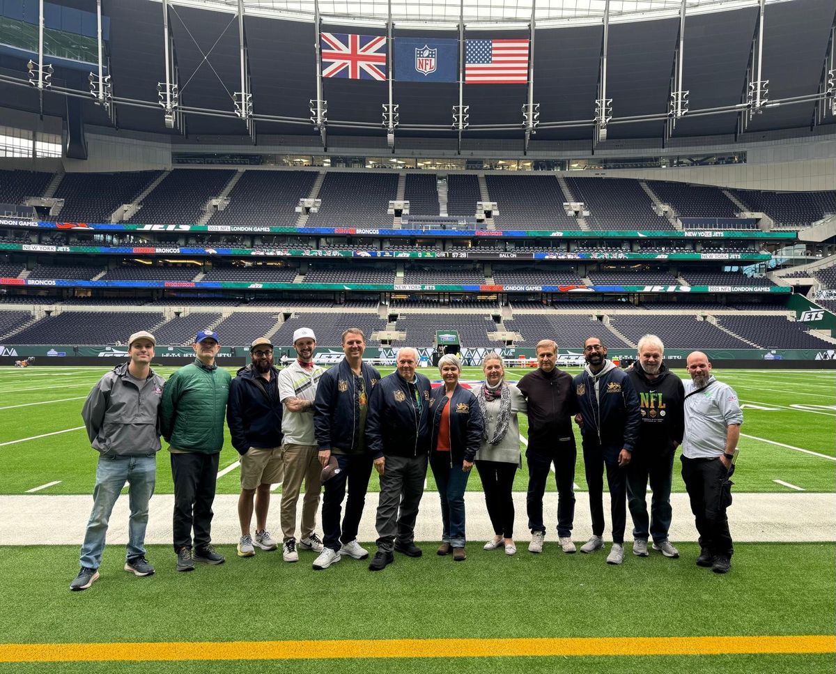 The WBL crew on the field at Tottenham Hotspur Stadium before a 2025 NFL London game